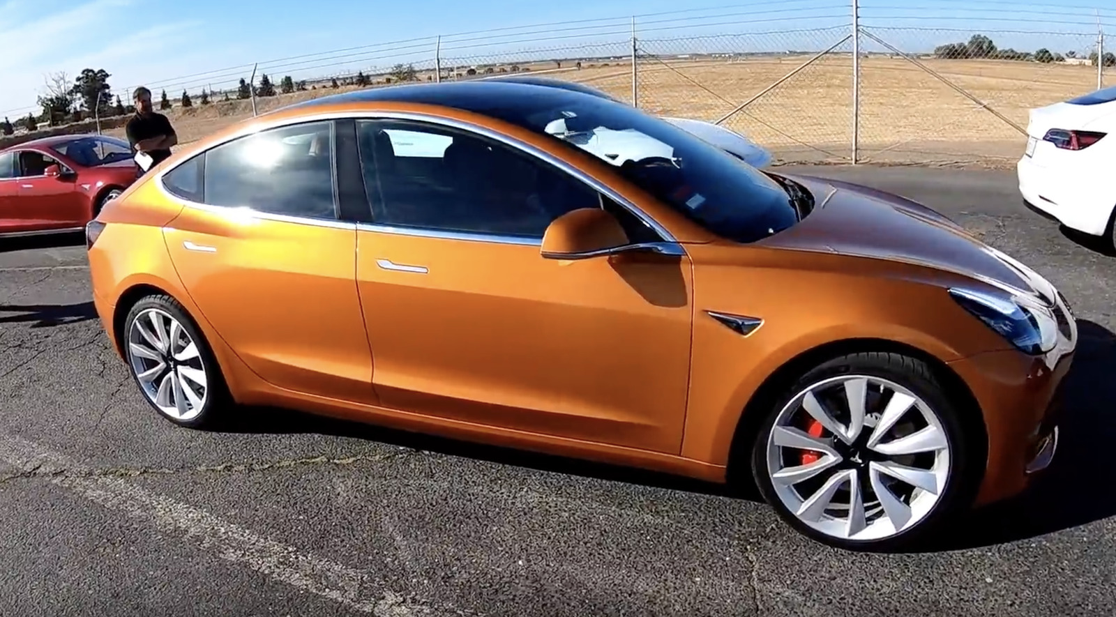 orange 2018 Tesla Model 3 Dual Motor Performance