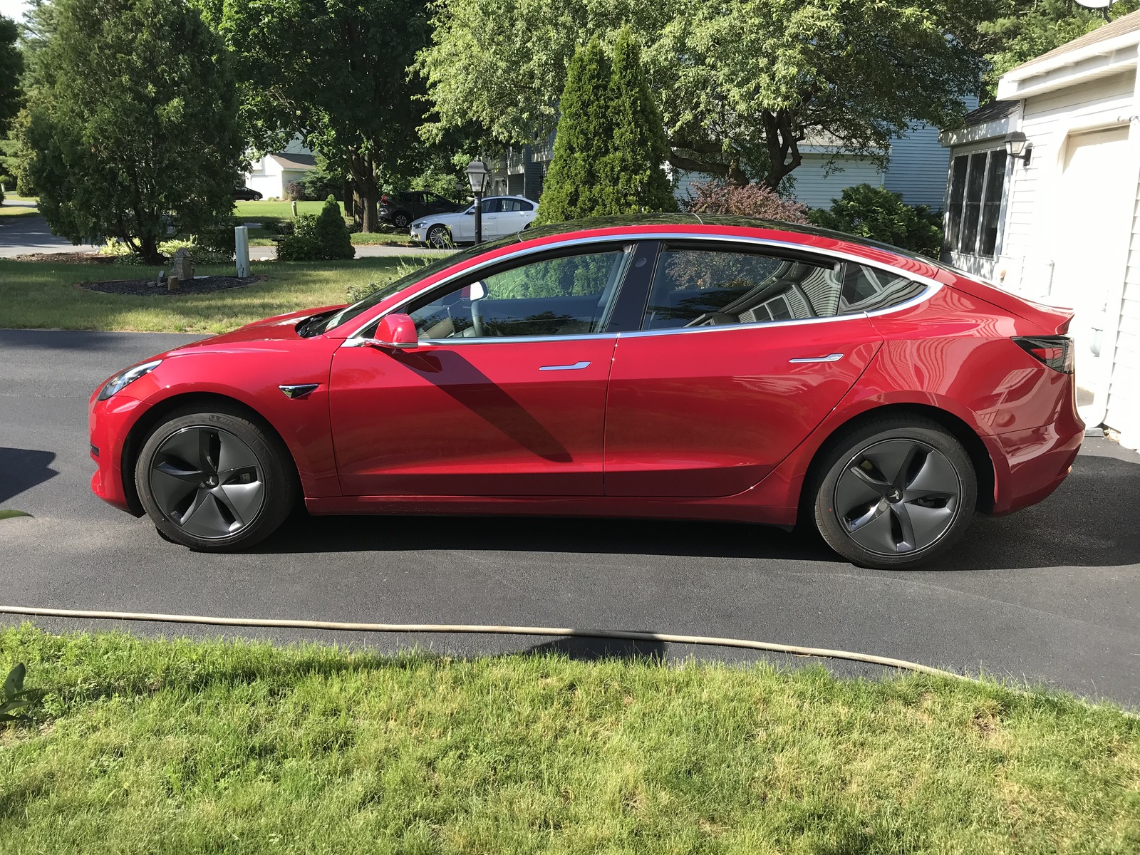 red 2020 Tesla Model 3 Performance (stealth)