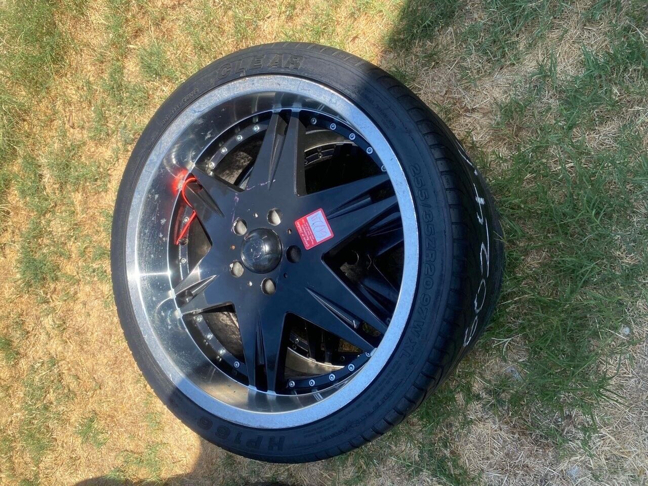 CLEAR 255/35ZR2097WXL TIRES WITH BLACK RIMS,