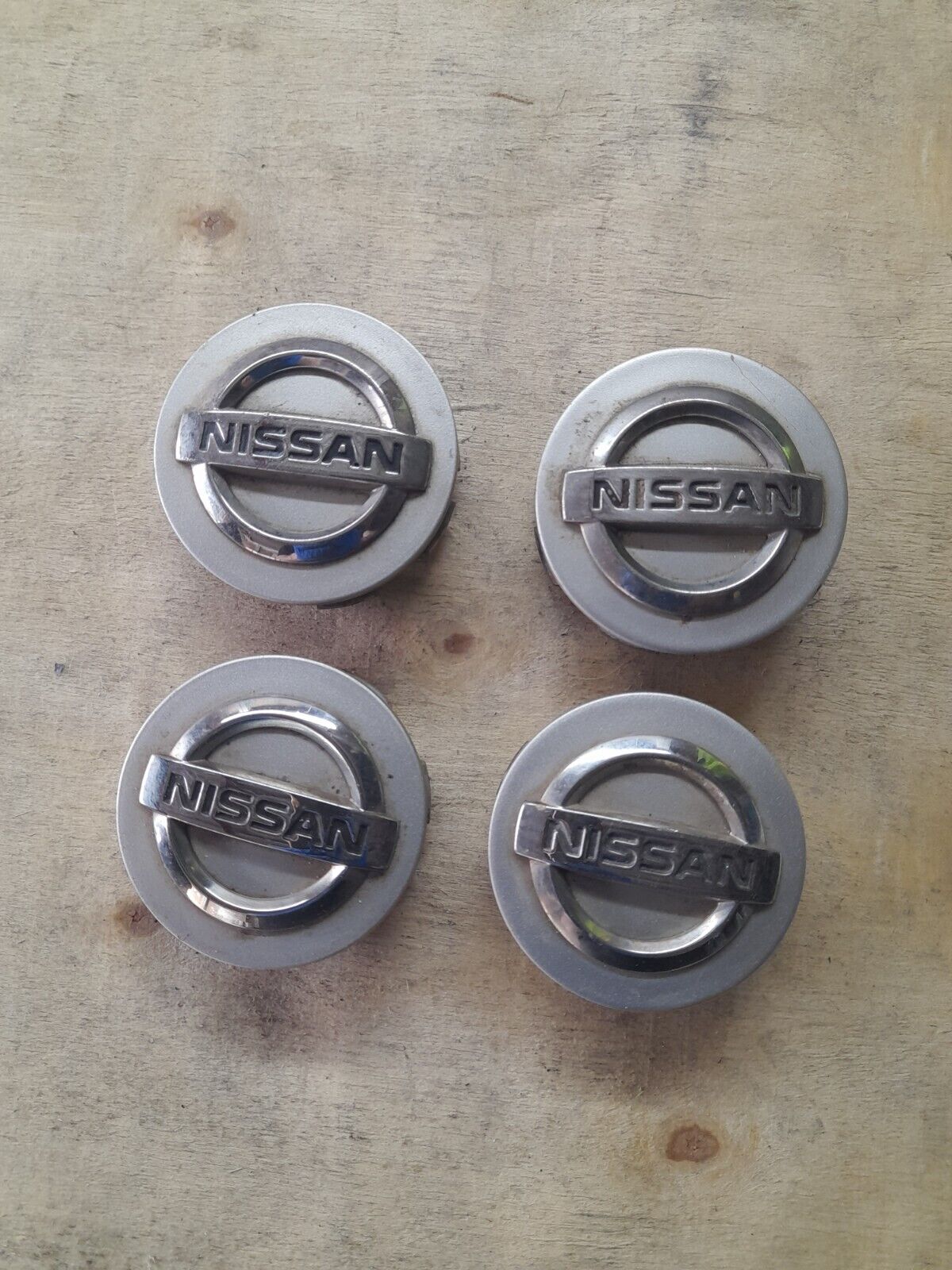 Set of Genuine Nissan Micra Juke Qashqai Pulsar Alloy wheel trims centre caps.